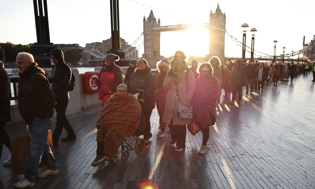 Line up of mourners in London for the Queen, 2022. Photo by George Cracknell Wright/The Guardian